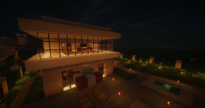casa de minecraft en la noche con luces